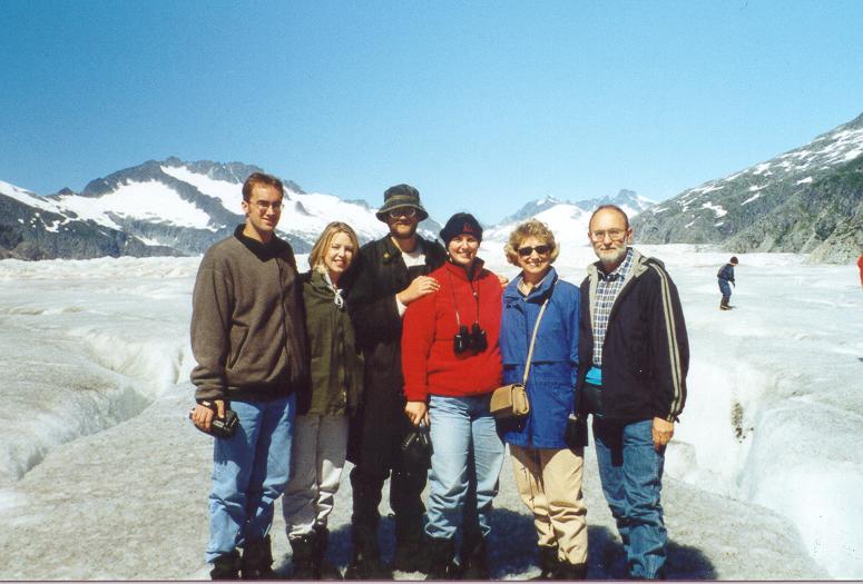 Photo of Tom & Lynda Plymate and their family standing on Mendenhall Glacier