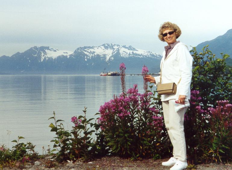 Photo of Lynda Plymate with fireweed in Valdez Harbor, Alaska