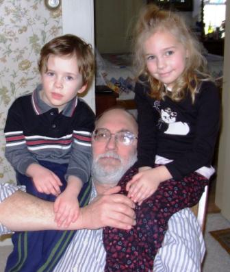 Photo of Alexander Reed Morton with his cousin Sophia and his Grandpa Tom, Christmas 2006