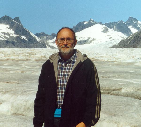 Photo of Dr. Plymate standing on Mendenhall Glacier, Alaska, August 2000
